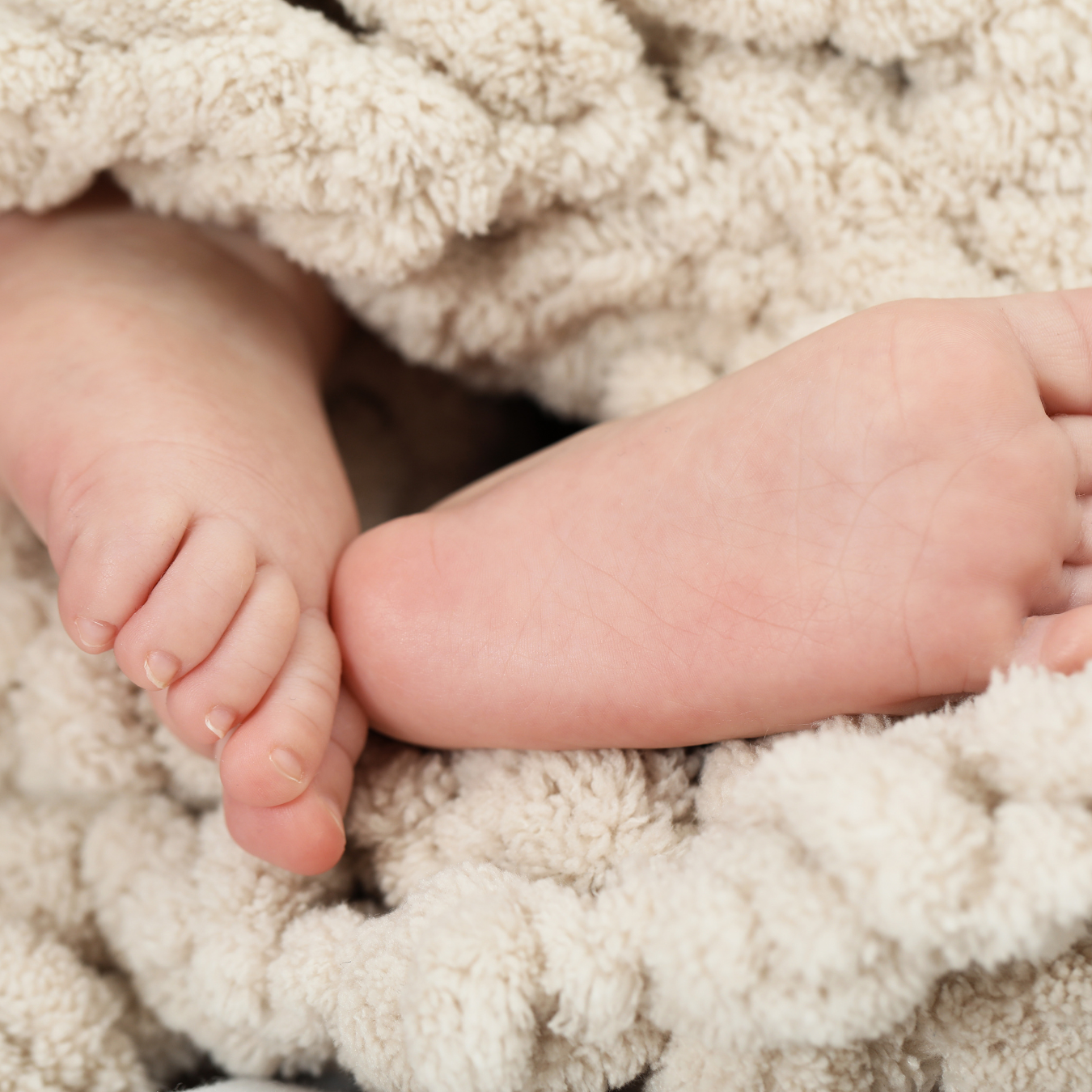 Baby wrapped snugly in a cozy blanket for warmth and comfort